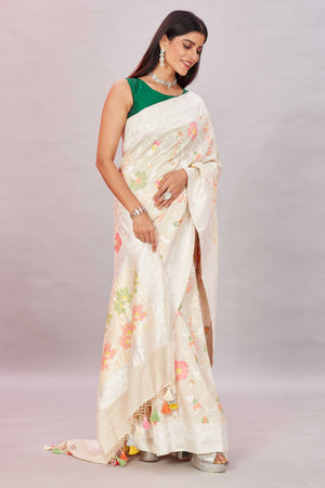 Shop cream tussar Banarasi saree online in USA with zari minakari floral jaal. Look your best on festive occasions in latest designer sarees, pure silk sarees, Kanjivaram silk sarees, handwoven saris, tussar silk sarees, embroidered saris from Pure Elegance Indian clothing store in USA.-side