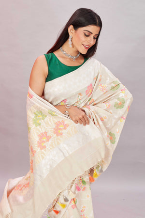 Shop cream tussar Banarasi saree online in USA with zari minakari floral jaal. Look your best on festive occasions in latest designer sarees, pure silk sarees, Kanjivaram silk sarees, handwoven saris, tussar silk sarees, embroidered saris from Pure Elegance Indian clothing store in USA.-closeup