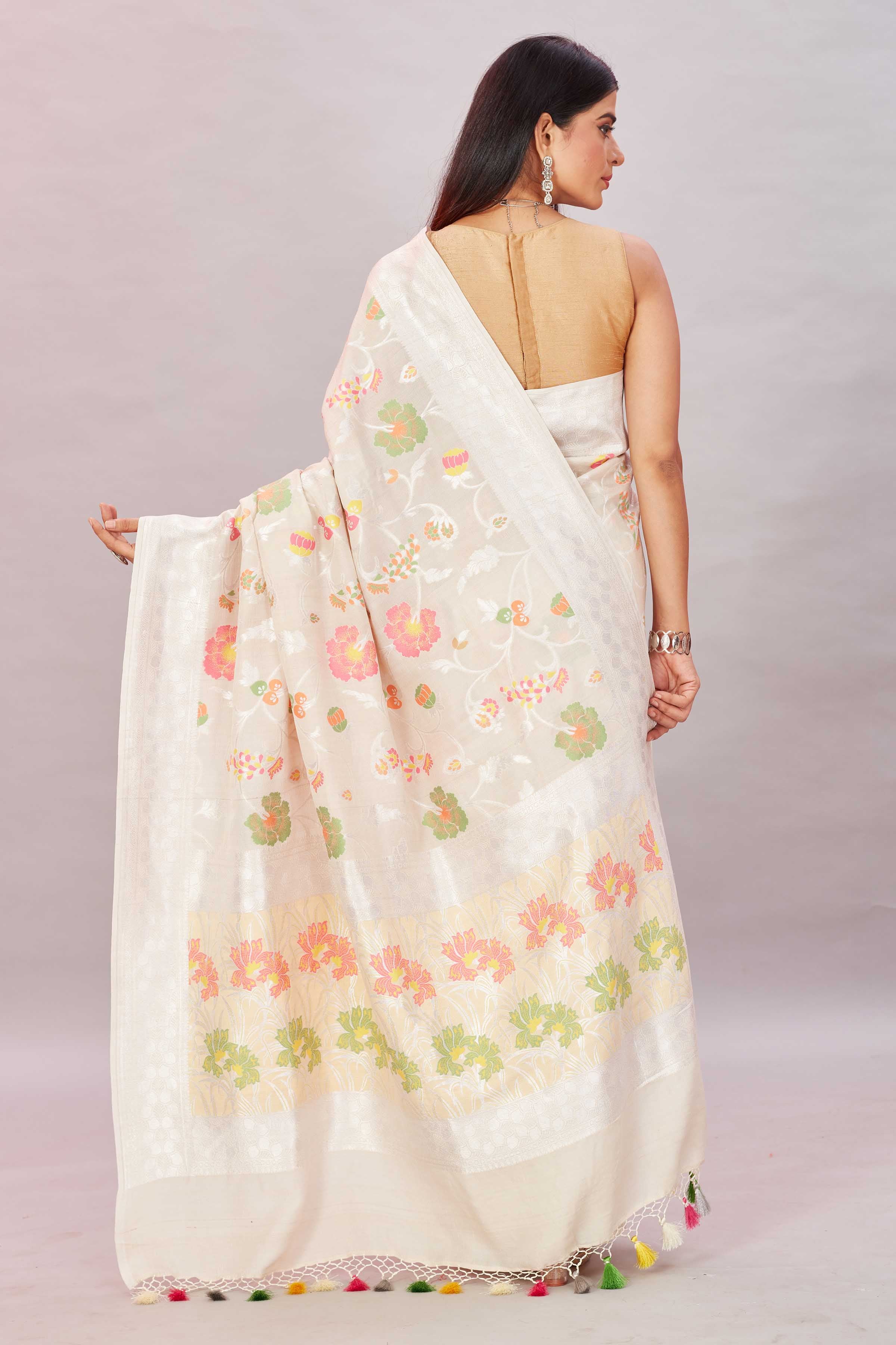 Shop off-white tussar Benarasi sari online in USA with zari minakari floral jaal. Look your best on festive occasions in latest designer sarees, pure silk sarees, Kanjivaram silk sarees, handwoven saris, tussar silk sarees, embroidered saris from Pure Elegance Indian clothing store in USA.-back