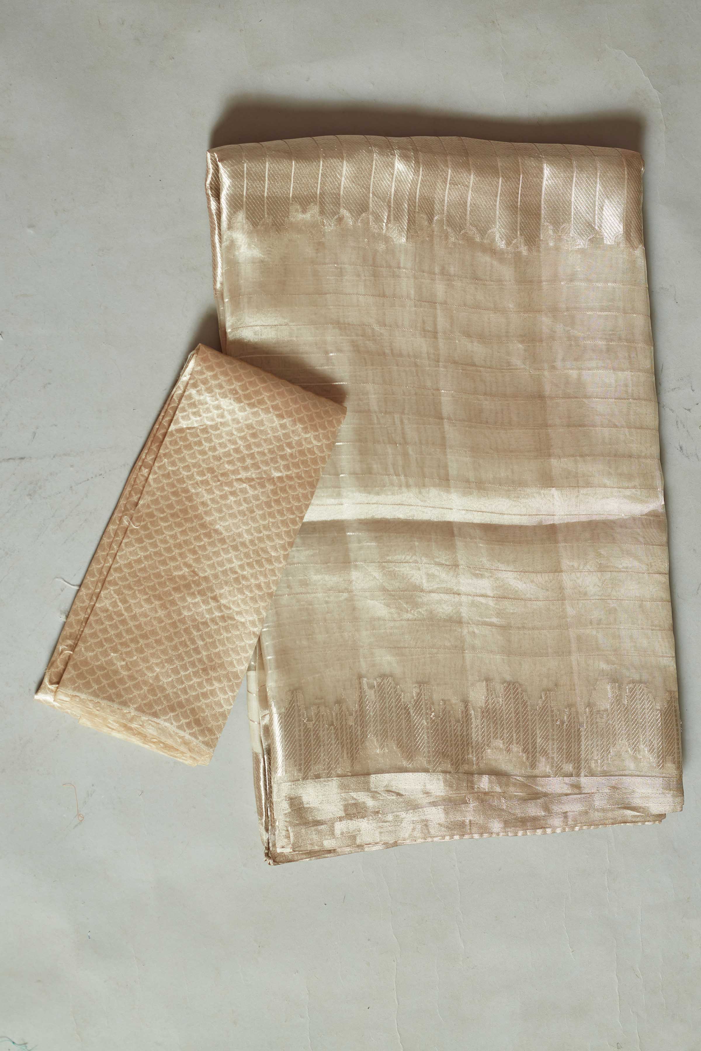 Shop stunning cream zari work tissue Banarasi saree online in USA. Look your best on festive occasions in latest designer sarees, pure silk sarees, Kanjivaram silk saris, handwoven saris, tussar silk sarees, embroidered saris from Pure Elegance Indian clothing store in USA.-blouse