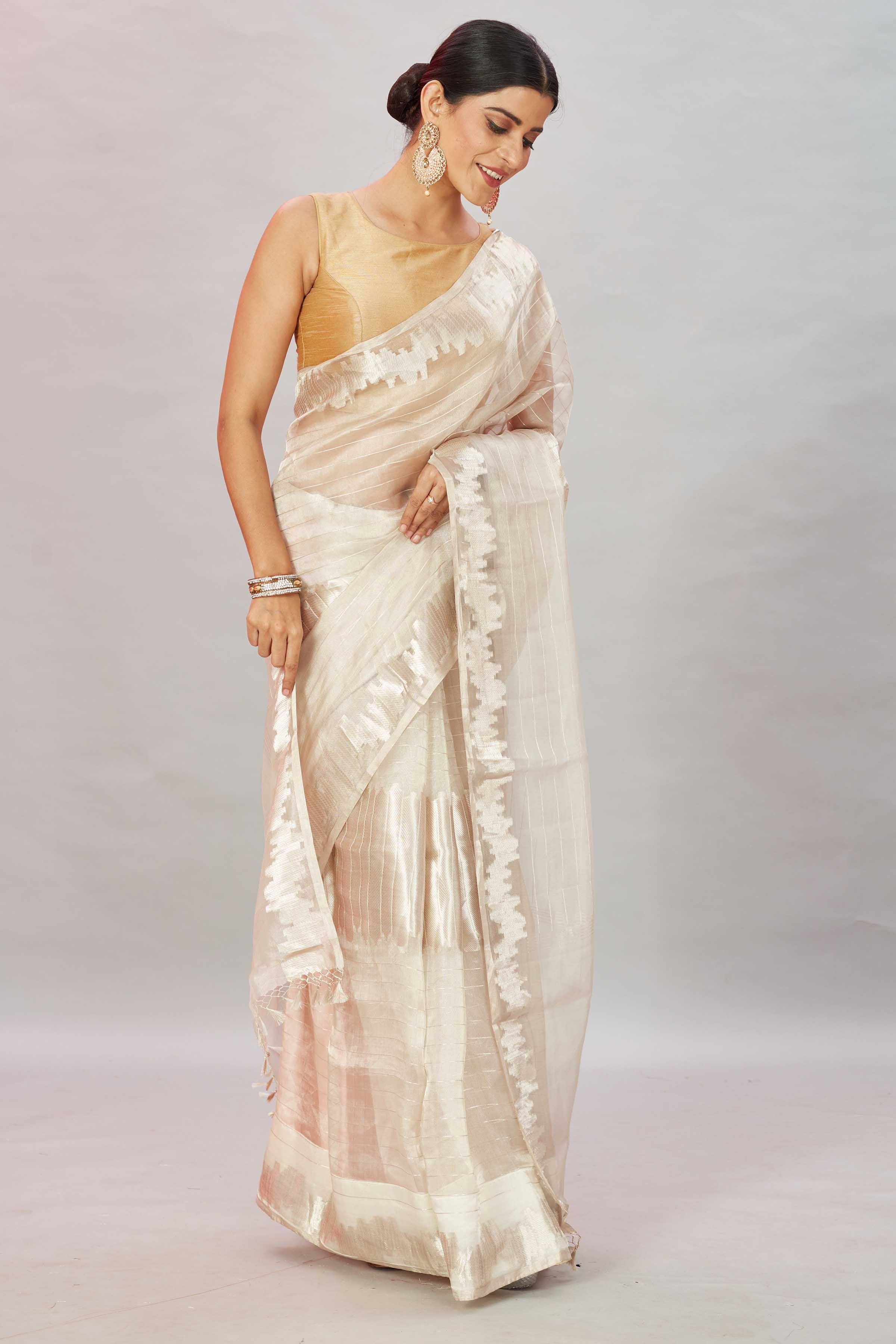 Shop stunning cream zari work tissue Banarasi saree online in USA. Look your best on festive occasions in latest designer sarees, pure silk sarees, Kanjivaram silk saris, handwoven saris, tussar silk sarees, embroidered saris from Pure Elegance Indian clothing store in USA.-side