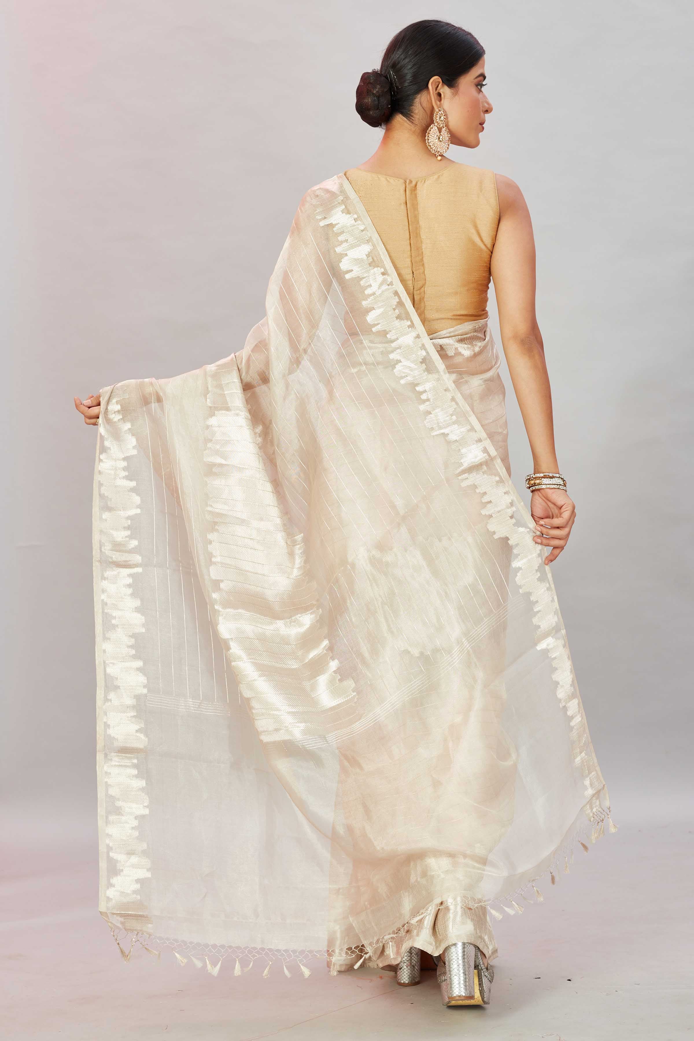 Shop stunning cream zari work tissue Banarasi saree online in USA. Look your best on festive occasions in latest designer sarees, pure silk sarees, Kanjivaram silk saris, handwoven saris, tussar silk sarees, embroidered saris from Pure Elegance Indian clothing store in USA.-back