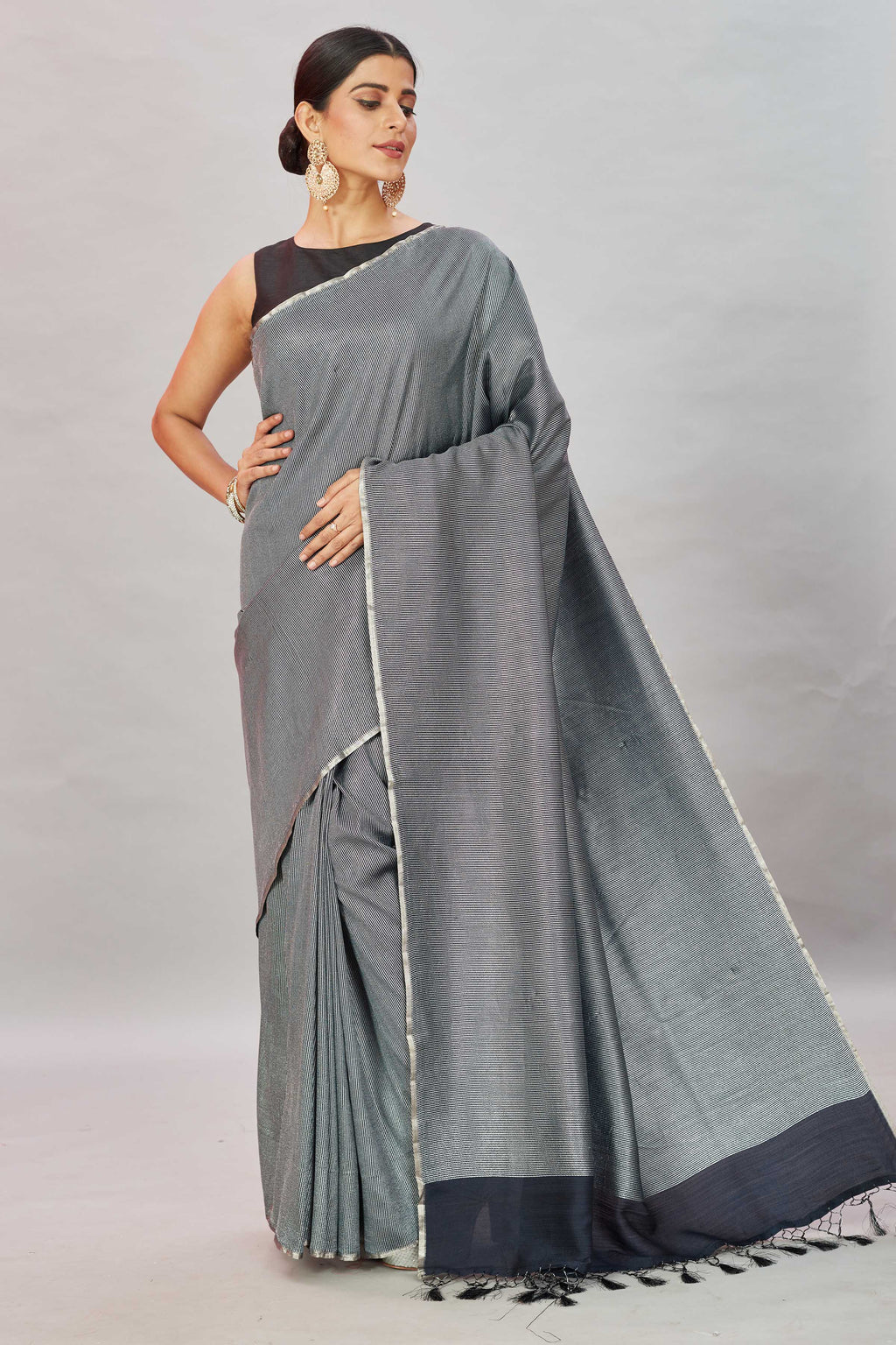 Shop stunning grey zari stripes Muga Banarasi sari online in USA. Look your best on festive occasions in latest designer saris, pure silk sarees, Kanjivaram silk sarees, handwoven saris, tussar silk sarees, embroidered saris from Pure Elegance Indian clothing store in USA.-full view