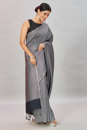 Shop stunning grey zari stripes Muga Banarasi sari online in USA. Look your best on festive occasions in latest designer saris, pure silk sarees, Kanjivaram silk sarees, handwoven saris, tussar silk sarees, embroidered saris from Pure Elegance Indian clothing store in USA.-side