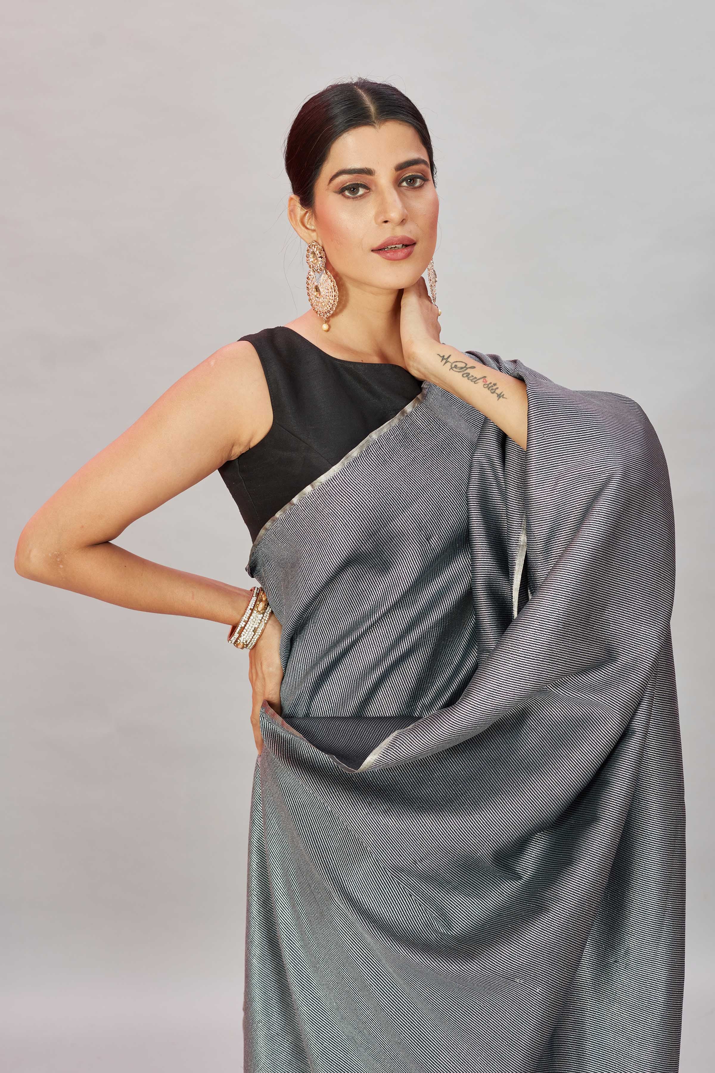 Shop stunning grey zari stripes Muga Banarasi sari online in USA. Look your best on festive occasions in latest designer saris, pure silk sarees, Kanjivaram silk sarees, handwoven saris, tussar silk sarees, embroidered saris from Pure Elegance Indian clothing store in USA.-closeup