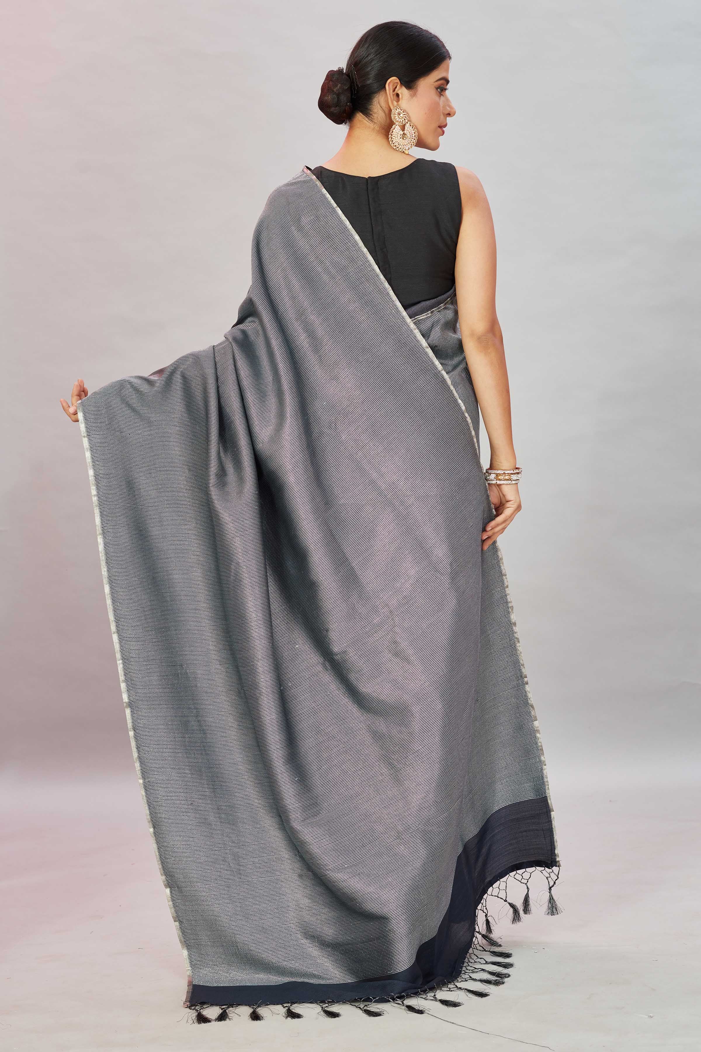 Shop stunning grey zari stripes Muga Banarasi sari online in USA. Look your best on festive occasions in latest designer saris, pure silk sarees, Kanjivaram silk sarees, handwoven saris, tussar silk sarees, embroidered saris from Pure Elegance Indian clothing store in USA.-back