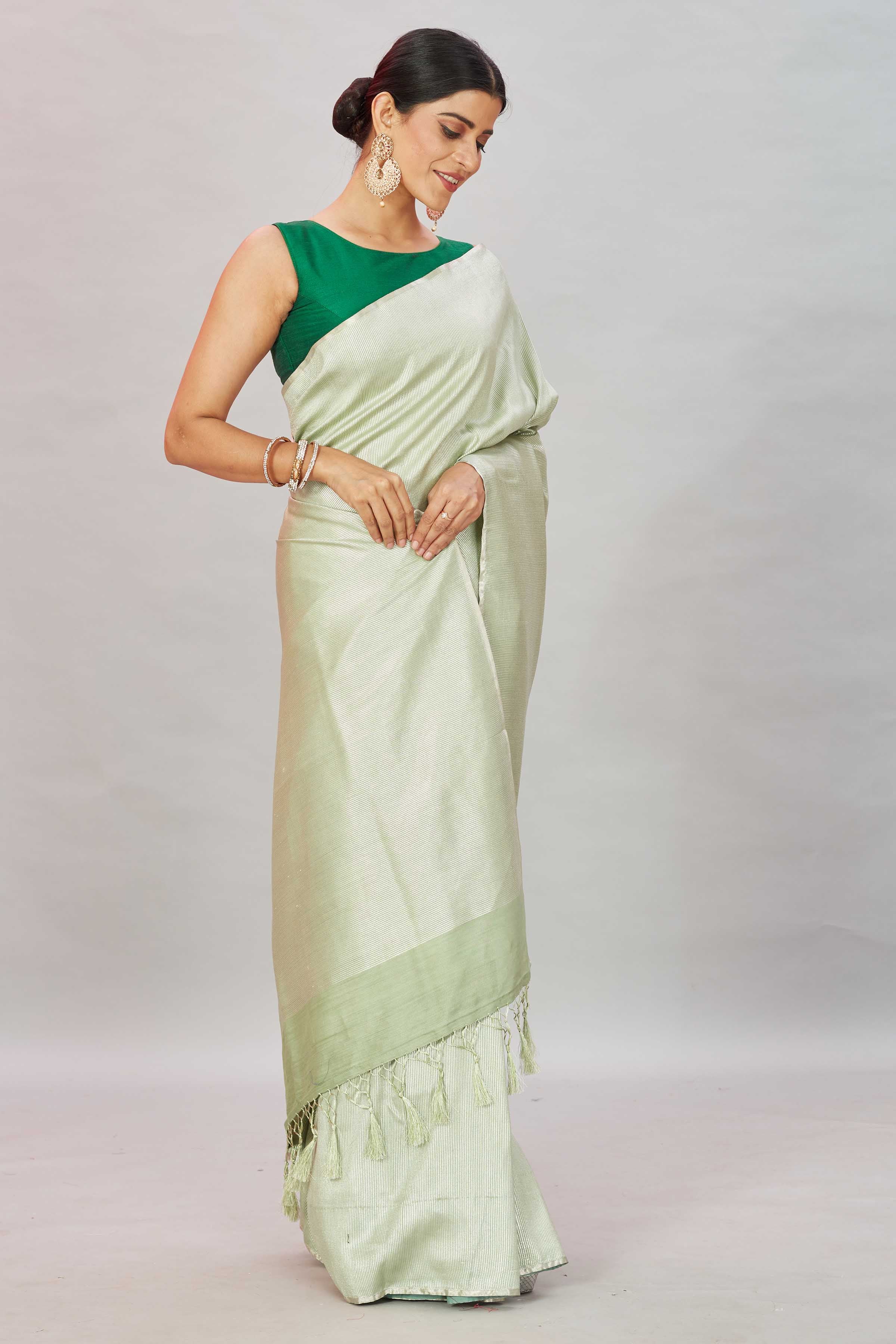 Buy Pistachio green zari stripes Muga Banarasi sari online in USA. Look your best on festive occasions in latest designer saris, pure silk sarees, Kanjivaram silk sarees, handwoven saris, tussar silk sarees, embroidered saris from Pure Elegance Indian clothing store in USA.-side