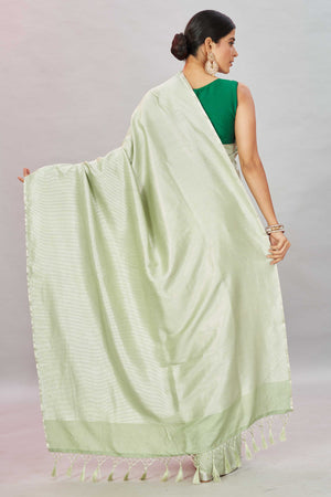 Buy Pistachio green zari stripes Muga Banarasi sari online in USA. Look your best on festive occasions in latest designer saris, pure silk sarees, Kanjivaram silk sarees, handwoven saris, tussar silk sarees, embroidered saris from Pure Elegance Indian clothing store in USA.-back