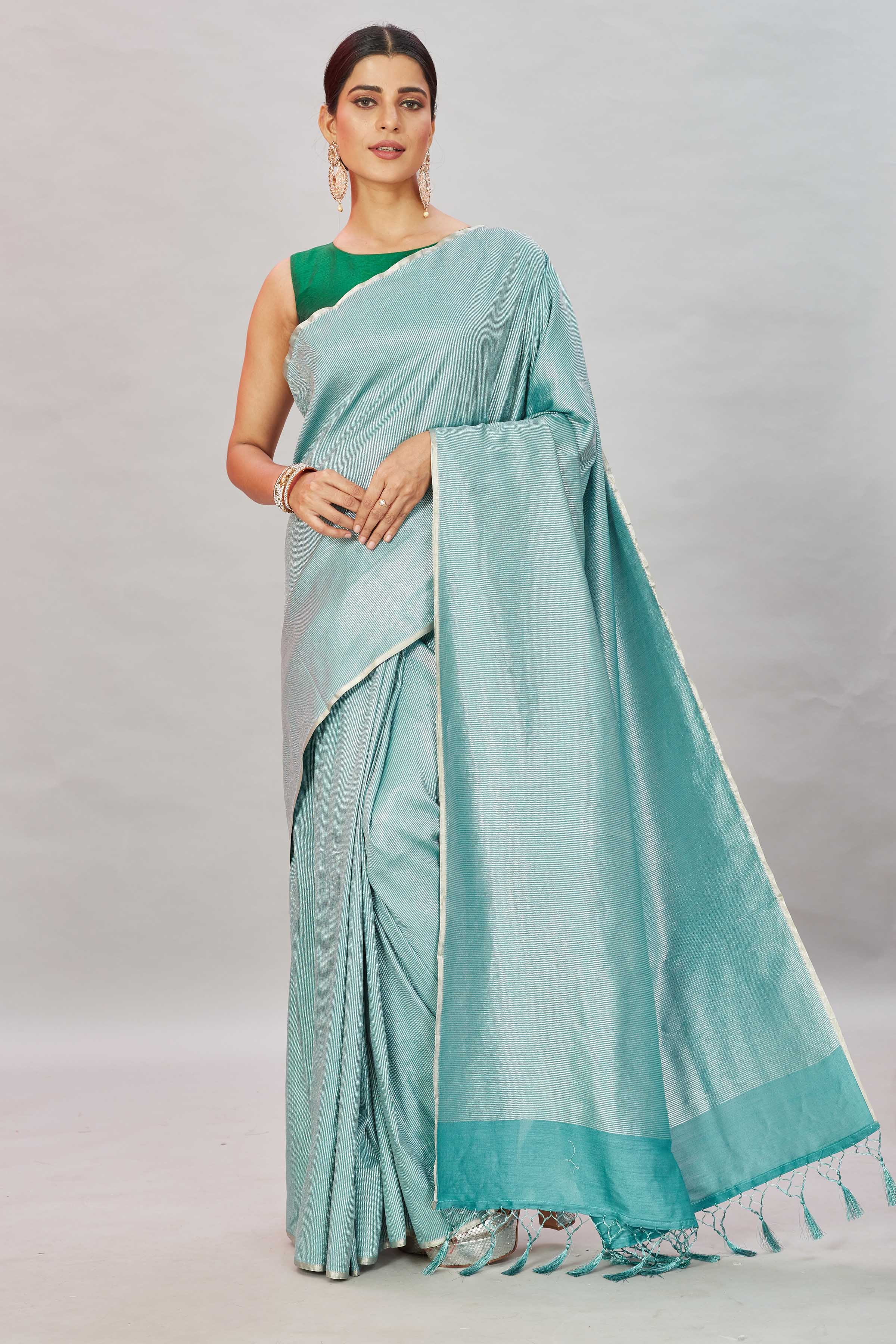 Shop green zari stripes Muga Banarasi sari online in USA. Look your best on festive occasions in latest designer saris, pure silk sarees, Kanjivaram silk sarees, handwoven saris, tussar silk sarees, embroidered saris from Pure Elegance Indian clothing store in USA.-full view