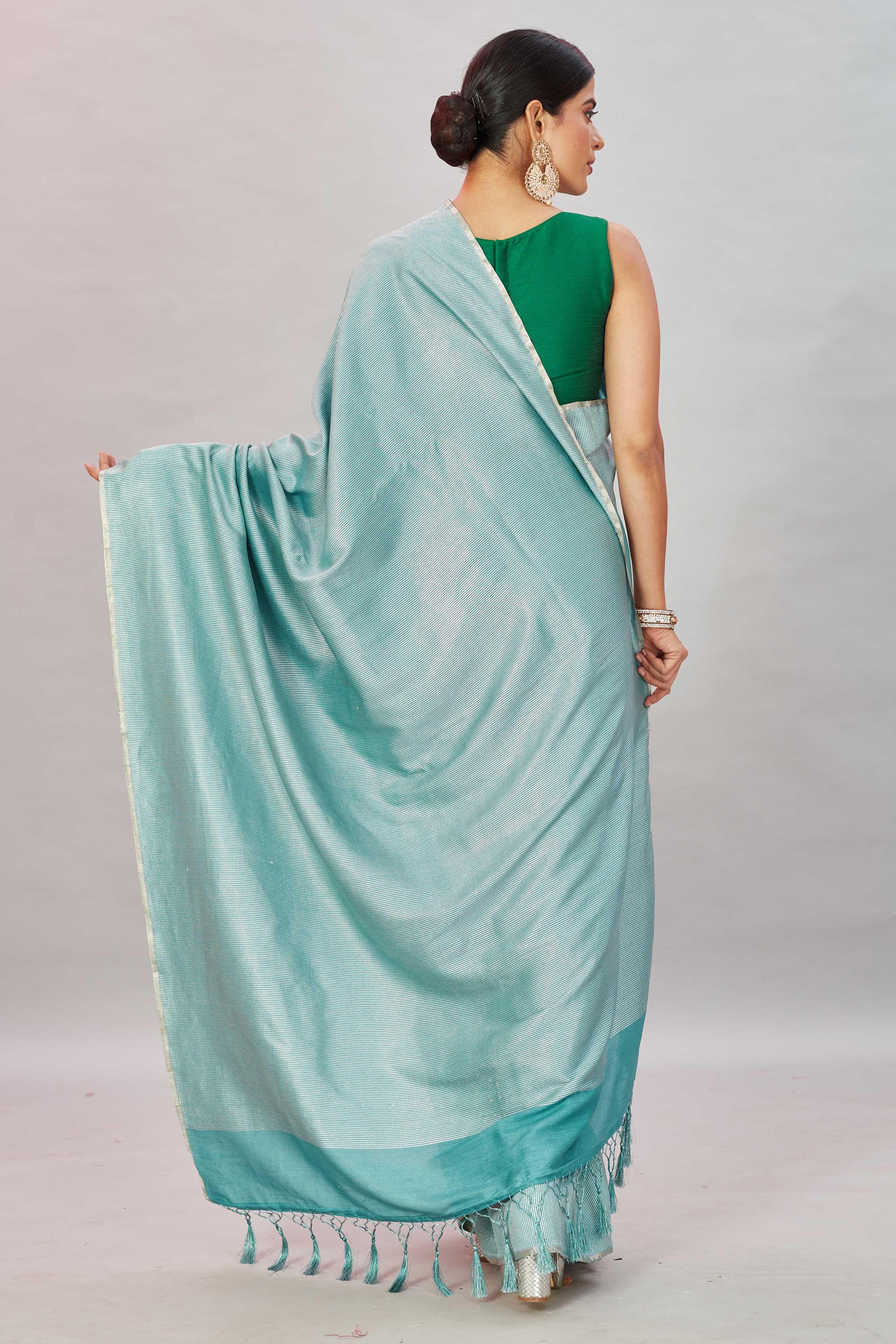 Shop green zari stripes Muga Banarasi sari online in USA. Look your best on festive occasions in latest designer saris, pure silk sarees, Kanjivaram silk sarees, handwoven saris, tussar silk sarees, embroidered saris from Pure Elegance Indian clothing store in USA.-back