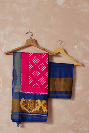 Shop pink Patola bandhej saree online in USA with brown blue border. Look your best on festive occasions in latest designer sarees, pure silk sarees, Kanjivaram silk saris, handwoven saris, tussar silk sarees, embroidered saris from Pure Elegance Indian clothing store in USA.-closeup