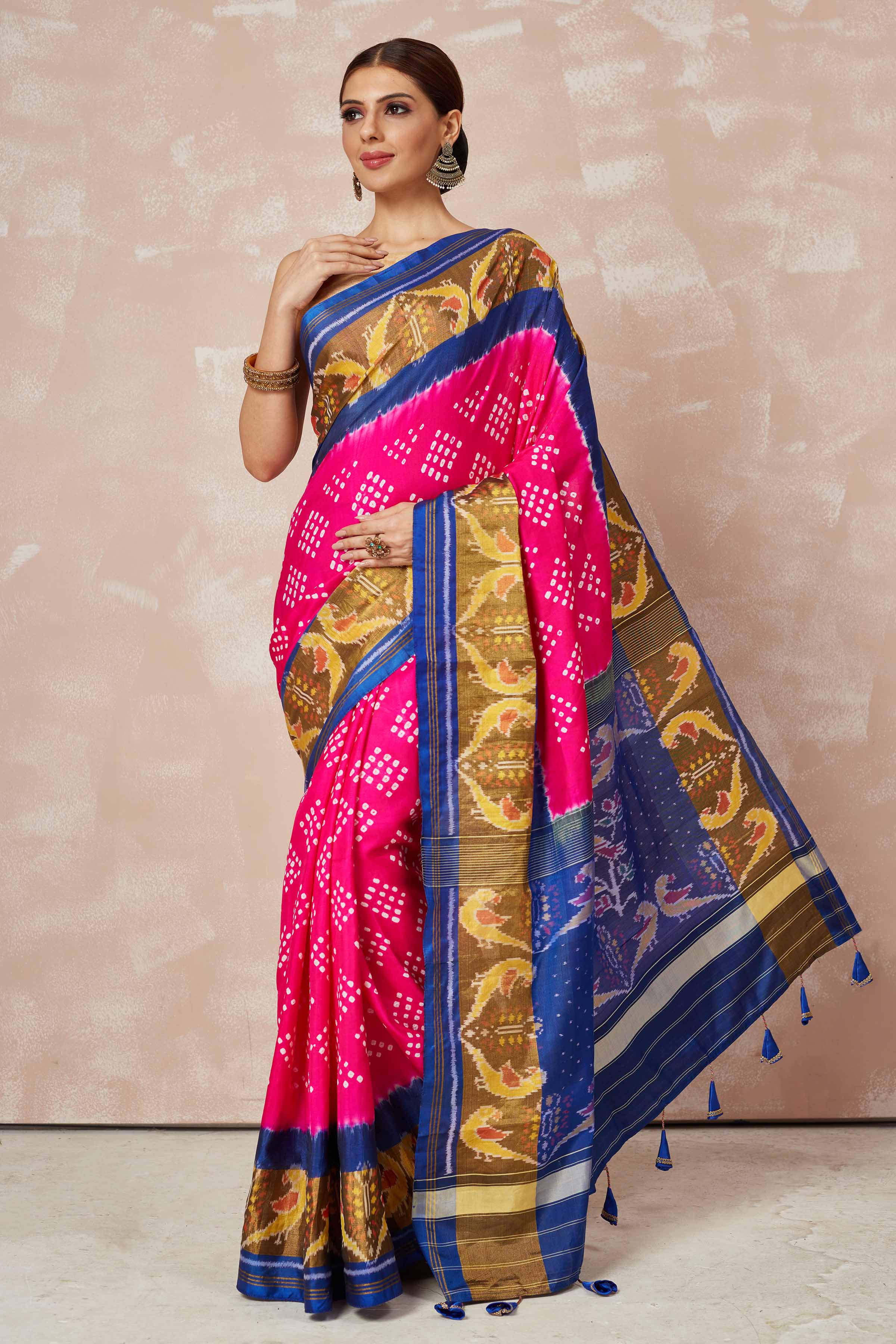 Shop pink Patola bandhej saree online in USA with brown blue border. Look your best on festive occasions in latest designer sarees, pure silk sarees, Kanjivaram silk saris, handwoven saris, tussar silk sarees, embroidered saris from Pure Elegance Indian clothing store in USA.-full view