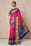 Shop pink Patola bandhej saree online in USA with brown blue border. Look your best on festive occasions in latest designer sarees, pure silk sarees, Kanjivaram silk saris, handwoven saris, tussar silk sarees, embroidered saris from Pure Elegance Indian clothing store in USA.-full view