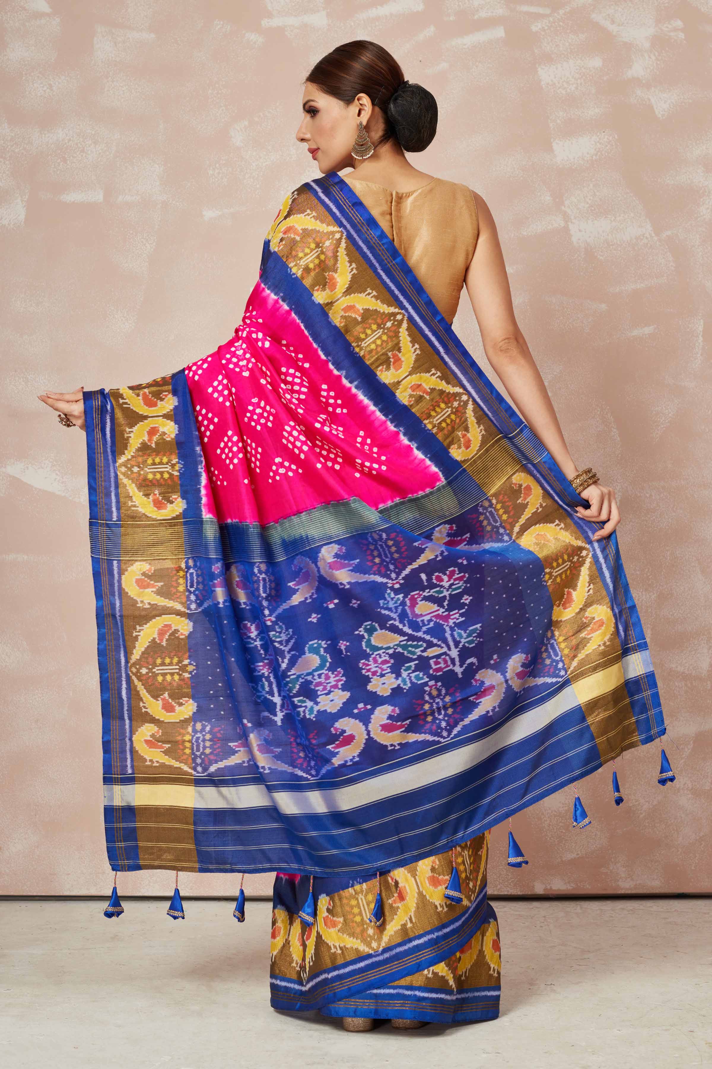 Shop pink Patola bandhej saree online in USA with brown blue border. Look your best on festive occasions in latest designer sarees, pure silk sarees, Kanjivaram silk saris, handwoven saris, tussar silk sarees, embroidered saris from Pure Elegance Indian clothing store in USA.-back