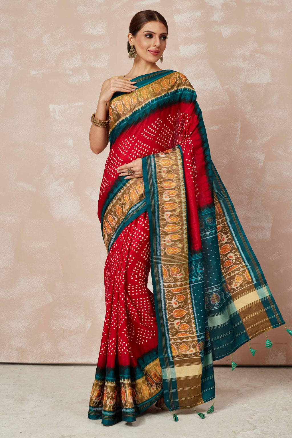 Buy red Patola bandhej saree online in USA with brown green border. Look your best on festive occasions in latest designer sarees, pure silk sarees, Kanjivaram silk saris, handwoven saris, tussar silk sarees, embroidered saris from Pure Elegance Indian clothing store in USA.-full view