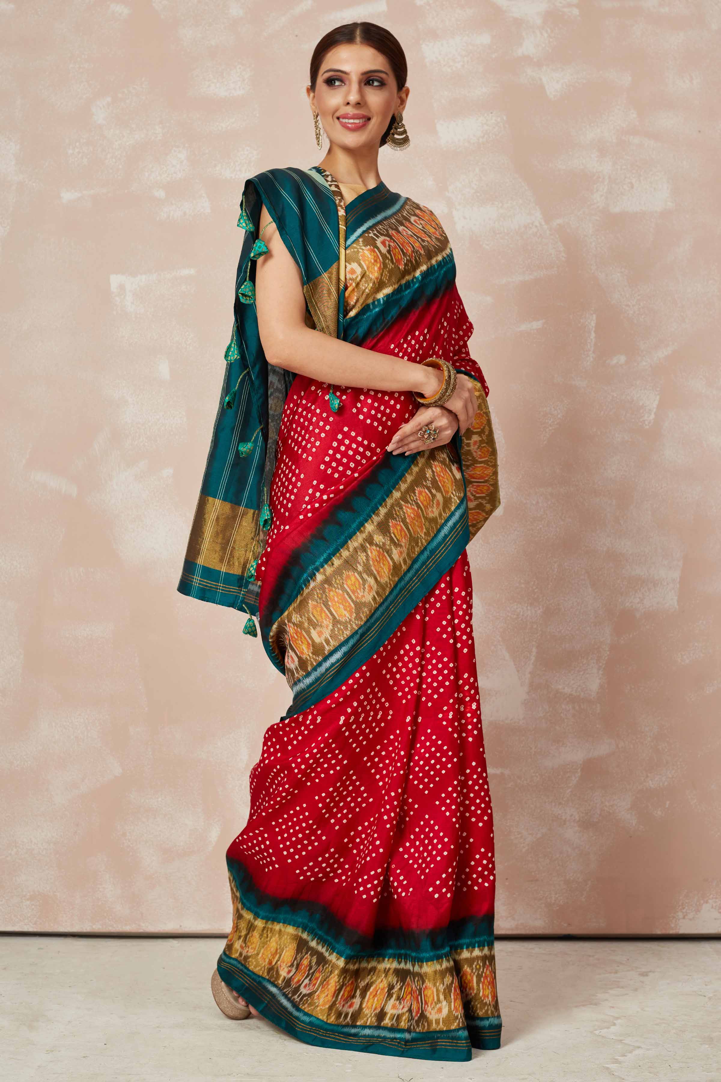 Buy red Patola bandhej saree online in USA with brown green border. Look your best on festive occasions in latest designer sarees, pure silk sarees, Kanjivaram silk saris, handwoven saris, tussar silk sarees, embroidered saris from Pure Elegance Indian clothing store in USA.-side