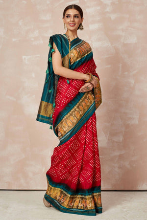 Buy red Patola bandhej saree online in USA with brown green border. Look your best on festive occasions in latest designer sarees, pure silk sarees, Kanjivaram silk saris, handwoven saris, tussar silk sarees, embroidered saris from Pure Elegance Indian clothing store in USA.-side