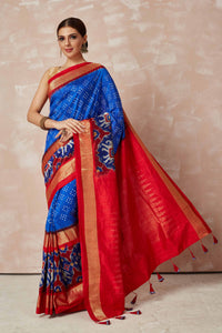 Shop turquoise blue bandhej sari online in USA with blue ikkat zari border and pallu. Look your best on festive occasions in latest designer sarees, pure silk sarees, Kanjivaram silk saris, handwoven saris, tussar silk sarees, embroidered saris from Pure Elegance Indian clothing store in USA.-full view