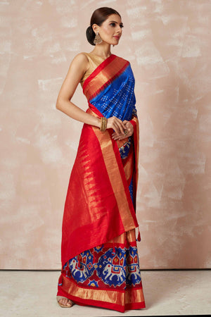 Shop turquoise blue bandhej sari online in USA with blue ikkat zari border and pallu. Look your best on festive occasions in latest designer sarees, pure silk sarees, Kanjivaram silk saris, handwoven saris, tussar silk sarees, embroidered saris from Pure Elegance Indian clothing store in USA.-side