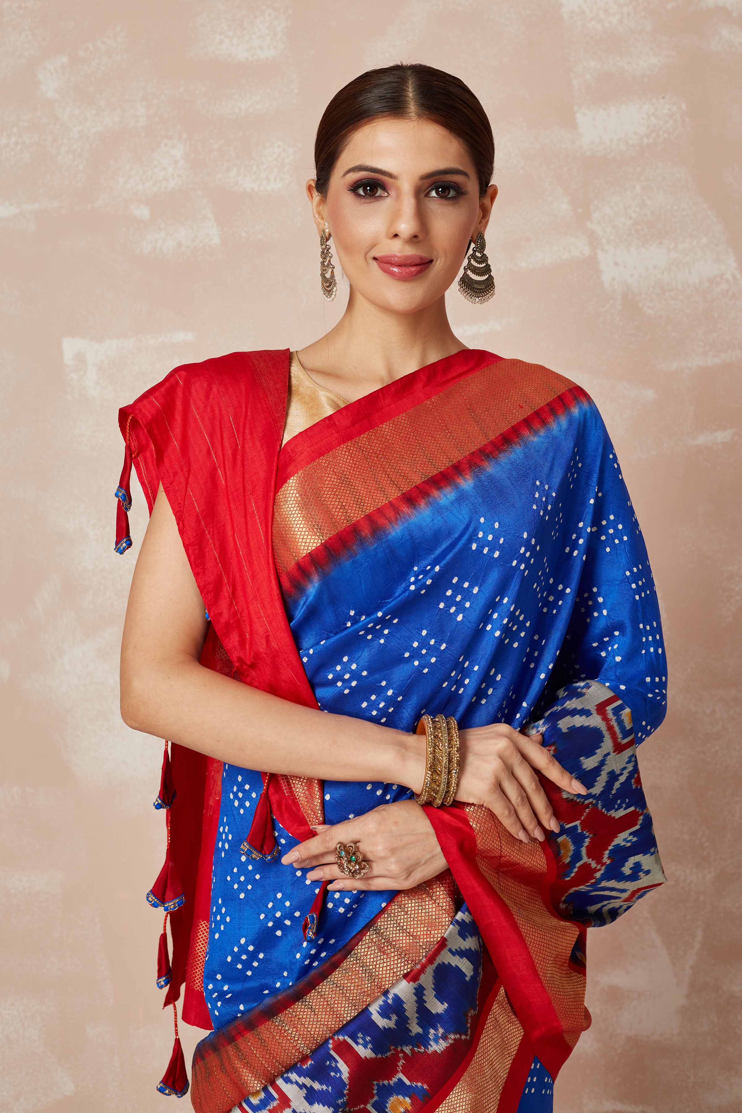 Shop turquoise blue bandhej sari online in USA with blue ikkat zari border and pallu. Look your best on festive occasions in latest designer sarees, pure silk sarees, Kanjivaram silk saris, handwoven saris, tussar silk sarees, embroidered saris from Pure Elegance Indian clothing store in USA.-closeup