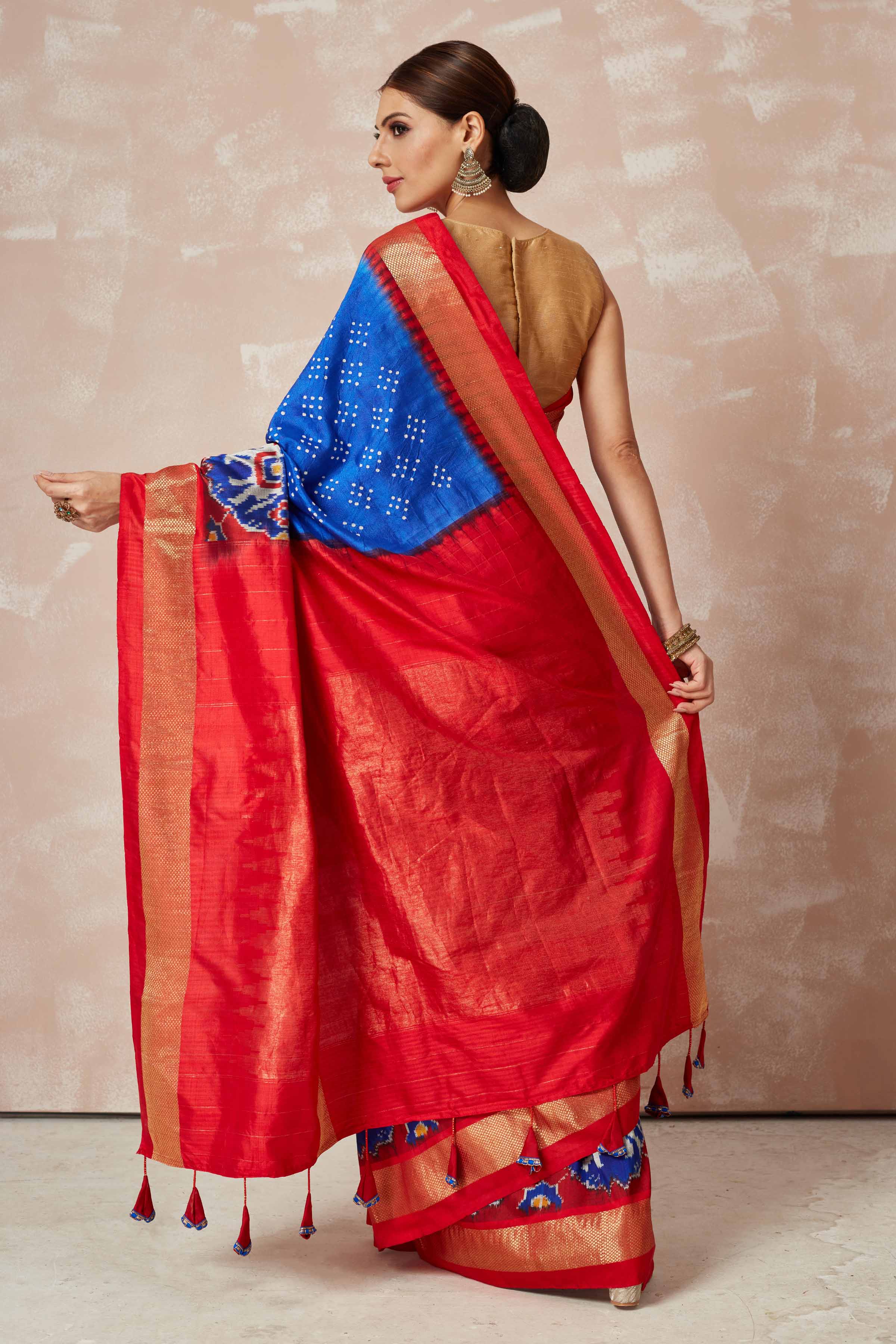 Shop turquoise blue bandhej sari online in USA with blue ikkat zari border and pallu. Look your best on festive occasions in latest designer sarees, pure silk sarees, Kanjivaram silk saris, handwoven saris, tussar silk sarees, embroidered saris from Pure Elegance Indian clothing store in USA.-back