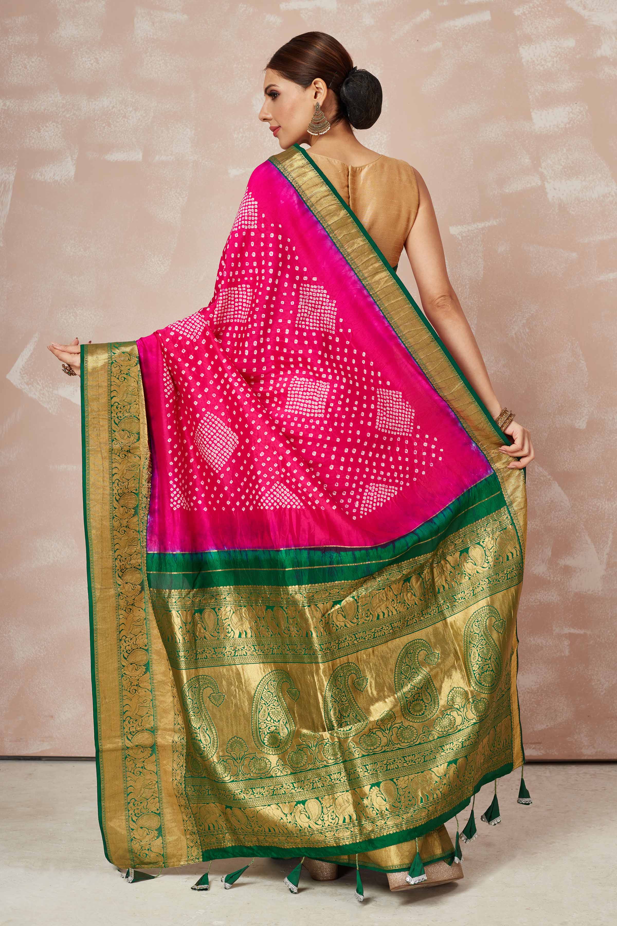 Shop pink bandhej saree online in USA with green zari border and pallu. Look your best on festive occasions in latest designer sarees, pure silk sarees, Kanjivaram silk saris, handwoven saris, tussar silk sarees, embroidered saris from Pure Elegance Indian clothing store in USA.-back