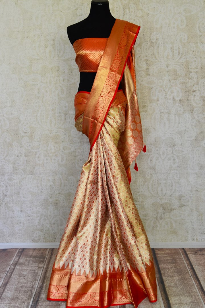 Buy golden heavy Kanjivaram silk saree online in USA with red zari border. Look your best on festive occasions in latest designer sarees, pure silk sarees, Kanjivaram silk saris, handwoven saris, tussar silk sarees, embroidered saris from Pure Elegance Indian clothing store in USA.-full view