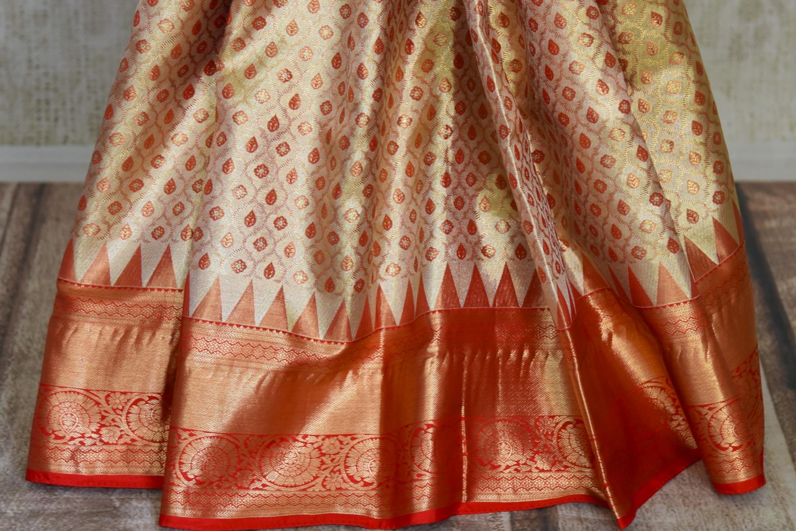 Buy golden heavy Kanjivaram silk saree online in USA with red zari border. Look your best on festive occasions in latest designer sarees, pure silk sarees, Kanjivaram silk saris, handwoven saris, tussar silk sarees, embroidered saris from Pure Elegance Indian clothing store in USA.-pleats