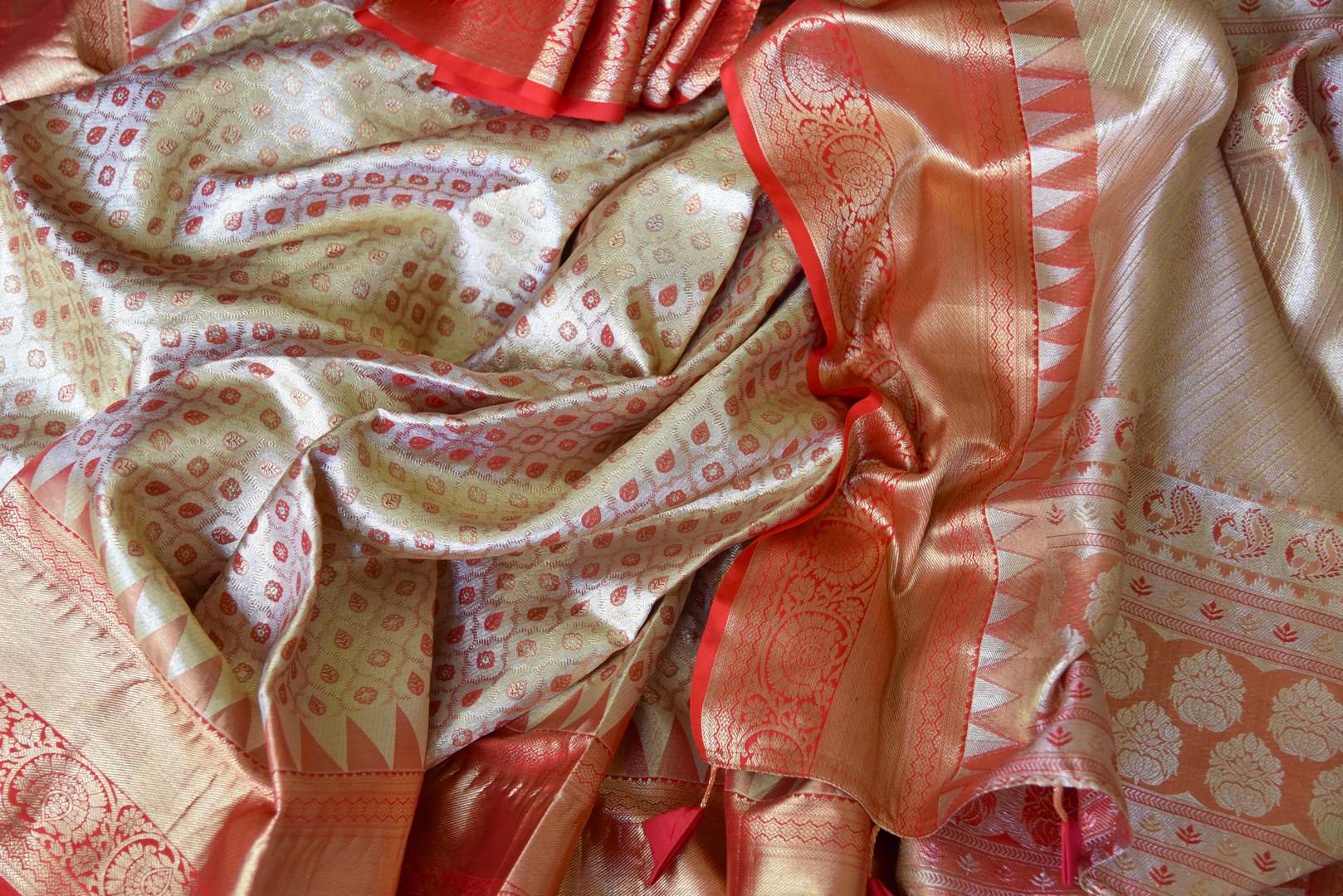 Buy golden heavy Kanjivaram silk saree online in USA with red zari border. Look your best on festive occasions in latest designer sarees, pure silk sarees, Kanjivaram silk saris, handwoven saris, tussar silk sarees, embroidered saris from Pure Elegance Indian clothing store in USA.-details