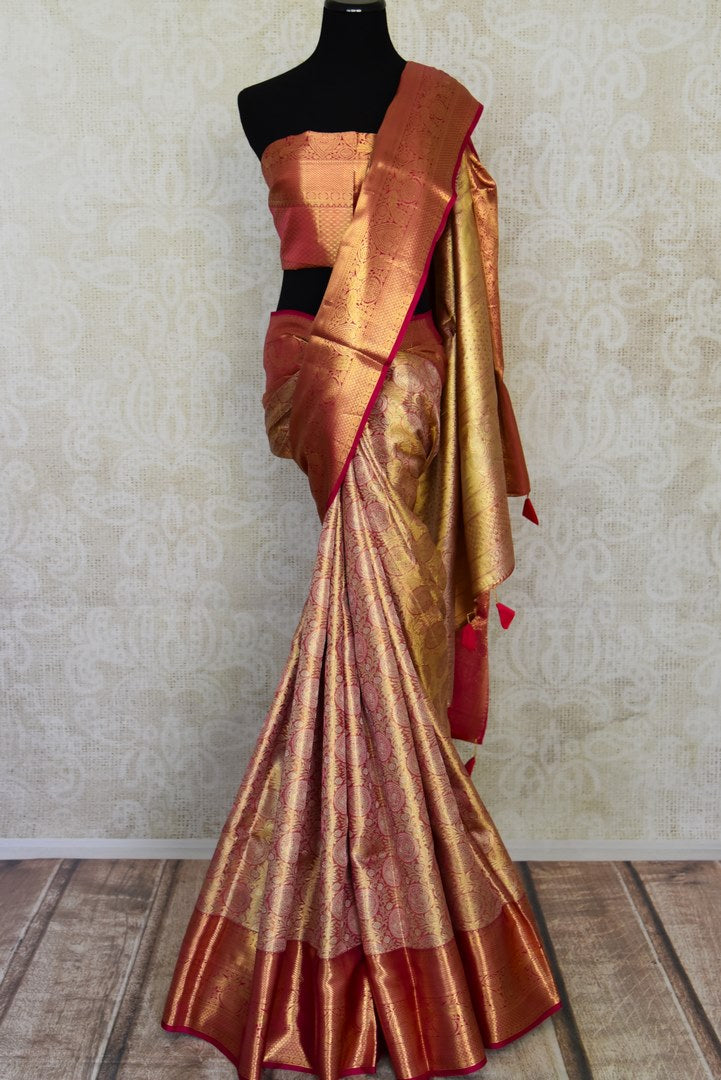 Buy golden pink Kanjivaram silk sari online in USA with pink zari border. Look your best on festive occasions in latest designer sarees, pure silk sarees, Kanjivaram silk saris, handwoven saris, tussar silk sarees, embroidered saris from Pure Elegance Indian clothing store in USA.-full view