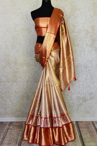 Buy golden heavy Kanjivaram silk sari online in USA with red zari border. Look your best on festive occasions in latest designer sarees, pure silk sarees, Kanjivaram silk saris, handwoven saris, tussar silk sarees, embroidered saris from Pure Elegance Indian clothing store in USA.-full vie