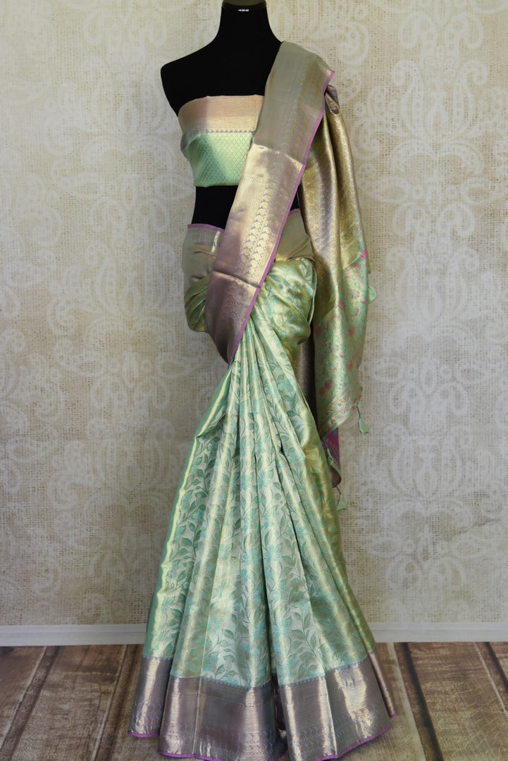 Buy mint green Kanjivaram silk sari online in USA with blue zari border. Look your best on festive occasions in latest designer sarees, pure silk sarees, Kanjivaram silk saris, handwoven saris, tussar silk sarees, embroidered saris from Pure Elegance Indian clothing store in USA.-full view