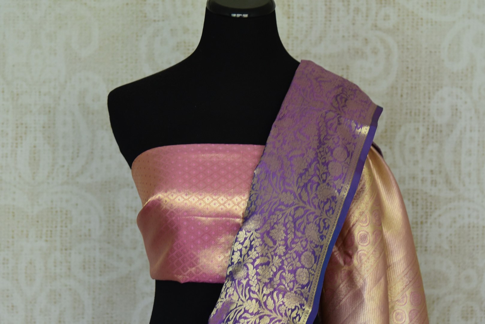 Buy golden and pink floral Kanjivaram silk saree online in USA with blue border. Look your best on festive occasions in latest designer sarees, pure silk sarees, Kanjivaram silk saris, handwoven saris, tussar silk sarees, embroidered saris from Pure Elegance Indian clothing store in USA.-closeup