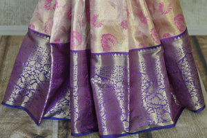 Buy golden and pink floral Kanjivaram silk saree online in USA with blue border. Look your best on festive occasions in latest designer sarees, pure silk sarees, Kanjivaram silk saris, handwoven saris, tussar silk sarees, embroidered saris from Pure Elegance Indian clothing store in USA.-pleats