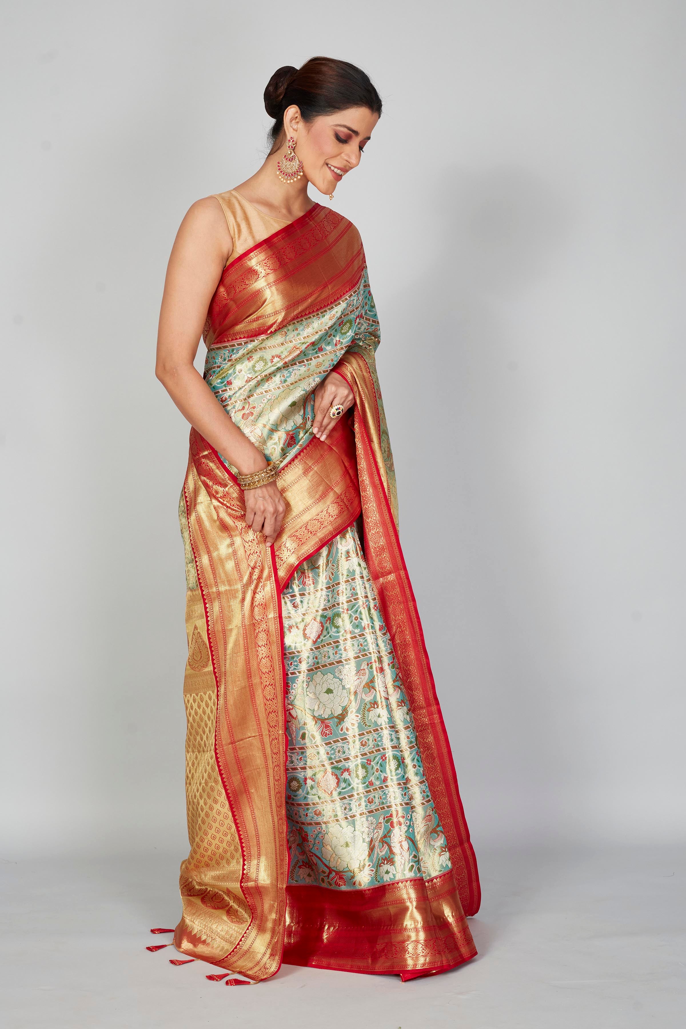 Buy pastel green Kanjeevaram silk sari online in USA with red zari border. Look your best on festive occasions in latest designer saris, pure silk saris, Kanjivaram silk sarees, handwoven saris, tussar silk sarees, embroidered saris from Pure Elegance Indian clothing store in USA.-side