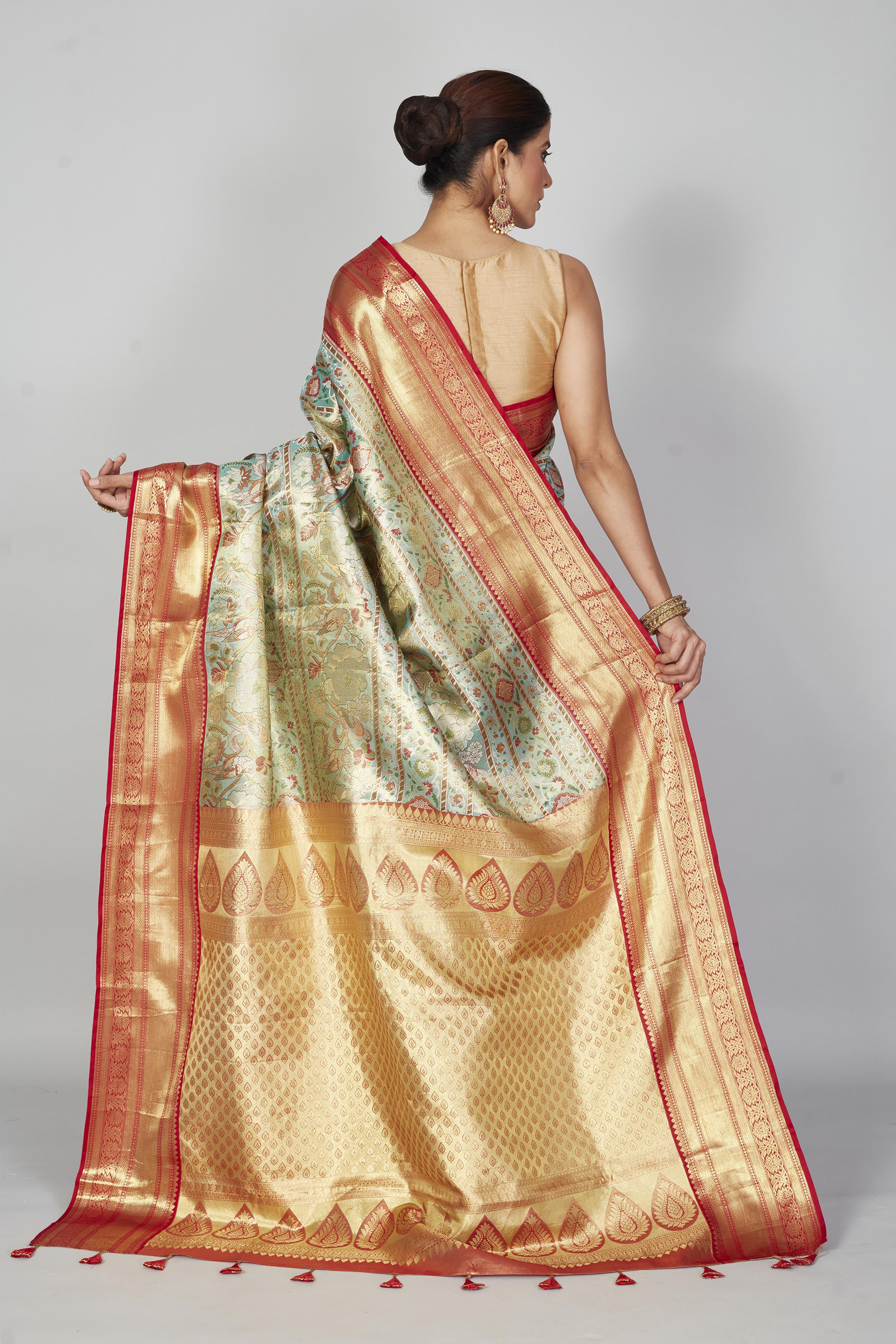 Buy pastel green Kanjeevaram silk sari online in USA with red zari border. Look your best on festive occasions in latest designer saris, pure silk saris, Kanjivaram silk sarees, handwoven saris, tussar silk sarees, embroidered saris from Pure Elegance Indian clothing store in USA.-back