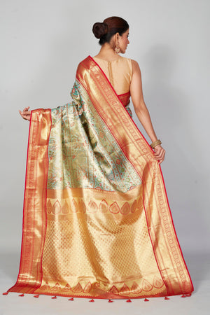 Buy pastel green Kanjeevaram silk sari online in USA with red zari border. Look your best on festive occasions in latest designer saris, pure silk saris, Kanjivaram silk sarees, handwoven saris, tussar silk sarees, embroidered saris from Pure Elegance Indian clothing store in USA.-back