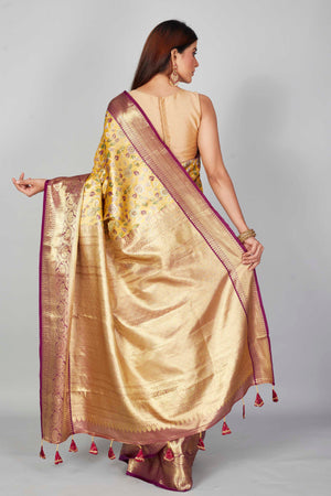 Buy yellow floral Kanjeevaram silk saree online in USA with purple zari border. Look your best on festive occasions in latest designer saris, pure silk saris, Kanjivaram silk sarees, handwoven saris, tussar silk sarees, embroidered saris from Pure Elegance Indian clothing store in USA.-back