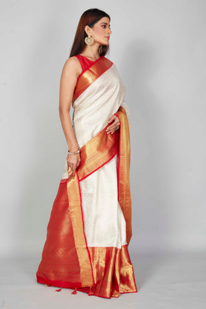 Shop white Kanchipuram silk saree online in USA with red zari border. Look your best on festive occasions in latest designer saris, pure silk saris, Kanjivaram silk sarees, handwoven saris, tussar silk sarees, embroidered saris from Pure Elegance Indian clothing store in USA.-side