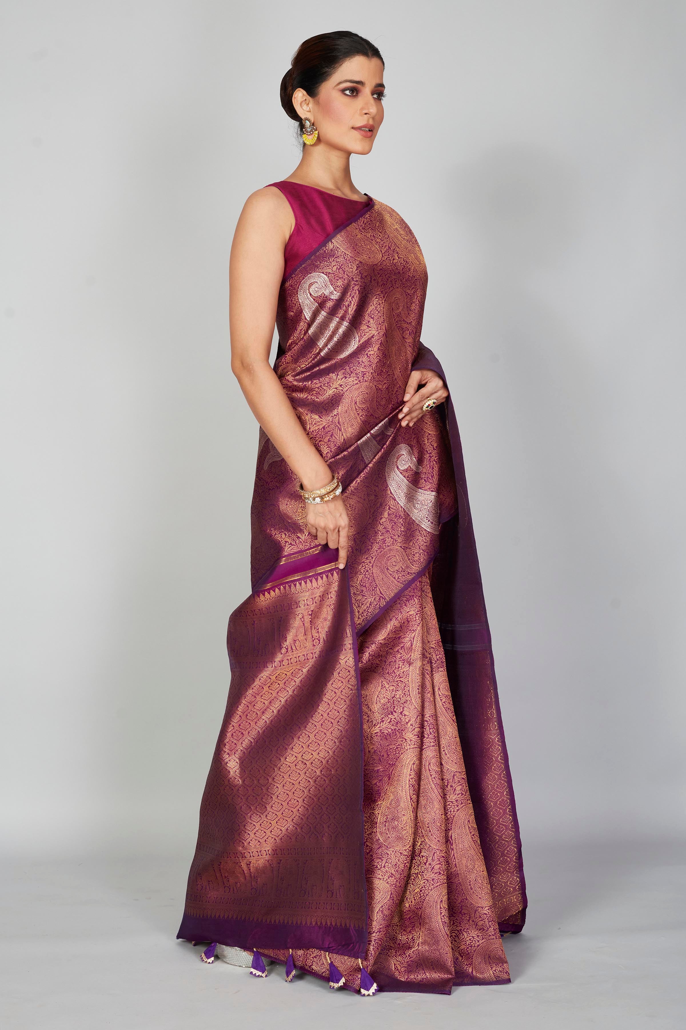 Shop purple zari Kanchipuram silk saree online in USA with silver paisley motifs. Look your best on festive occasions in latest designer saris, pure silk saris, Kanjivaram silk sarees, handwoven saris, tussar silk sarees, embroidered sarees from Pure Elegance Indian clothing store in USA.-side