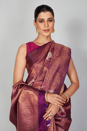 Shop purple zari Kanchipuram silk saree online in USA with silver paisley motifs. Look your best on festive occasions in latest designer saris, pure silk saris, Kanjivaram silk sarees, handwoven saris, tussar silk sarees, embroidered sarees from Pure Elegance Indian clothing store in USA.-closeup