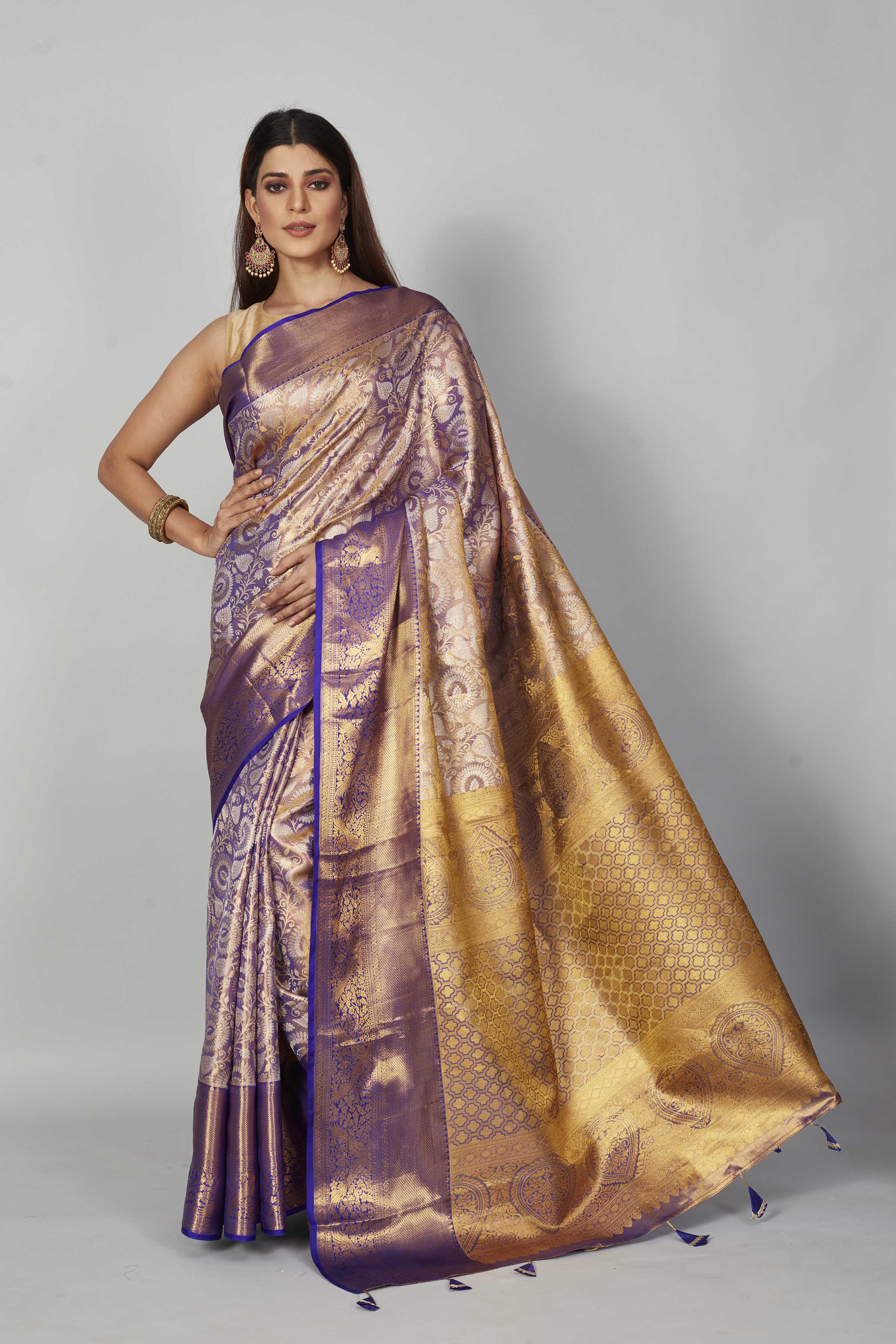 Shop purple heavy Kanchipuram silk sari online in USA with golden zari pallu. Look your best on festive occasions in latest designer saris, pure silk saris, Kanjivaram silk sarees, handwoven saris, tussar silk sarees, embroidered sarees from Pure Elegance Indian clothing store in USA.-full view