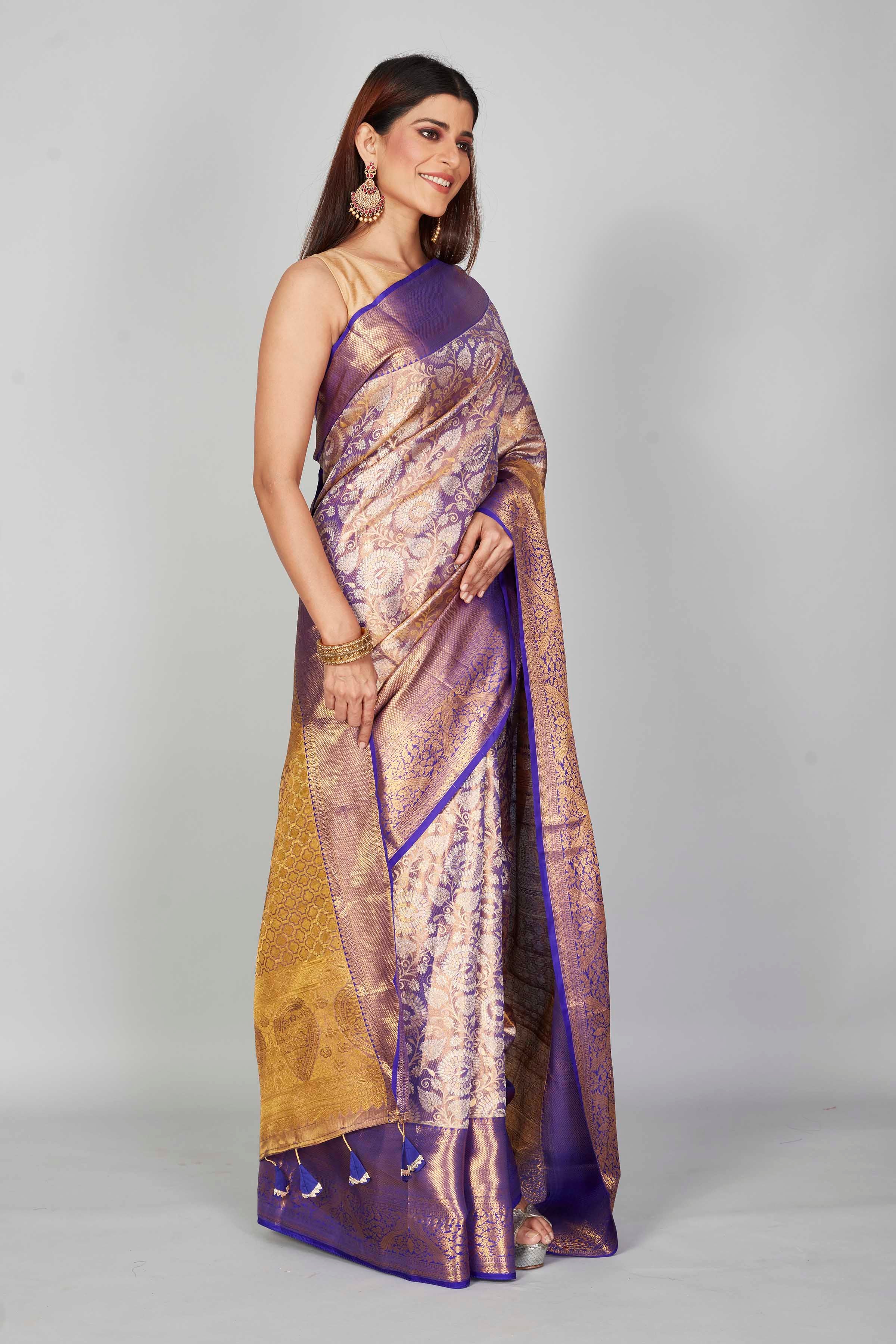 Shop purple heavy Kanchipuram silk sari online in USA with golden zari pallu. Look your best on festive occasions in latest designer saris, pure silk saris, Kanjivaram silk sarees, handwoven saris, tussar silk sarees, embroidered sarees from Pure Elegance Indian clothing store in USA.-side