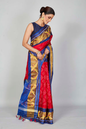 Buy red silk Bandhej sari online in USA with blue brown border. Look your best on festive occasions in latest designer saris, pure silk saris, Kanjivaram silk sarees, handwoven saris, tussar silk sarees, embroidered sarees from Pure Elegance Indian clothing store in USA.-side