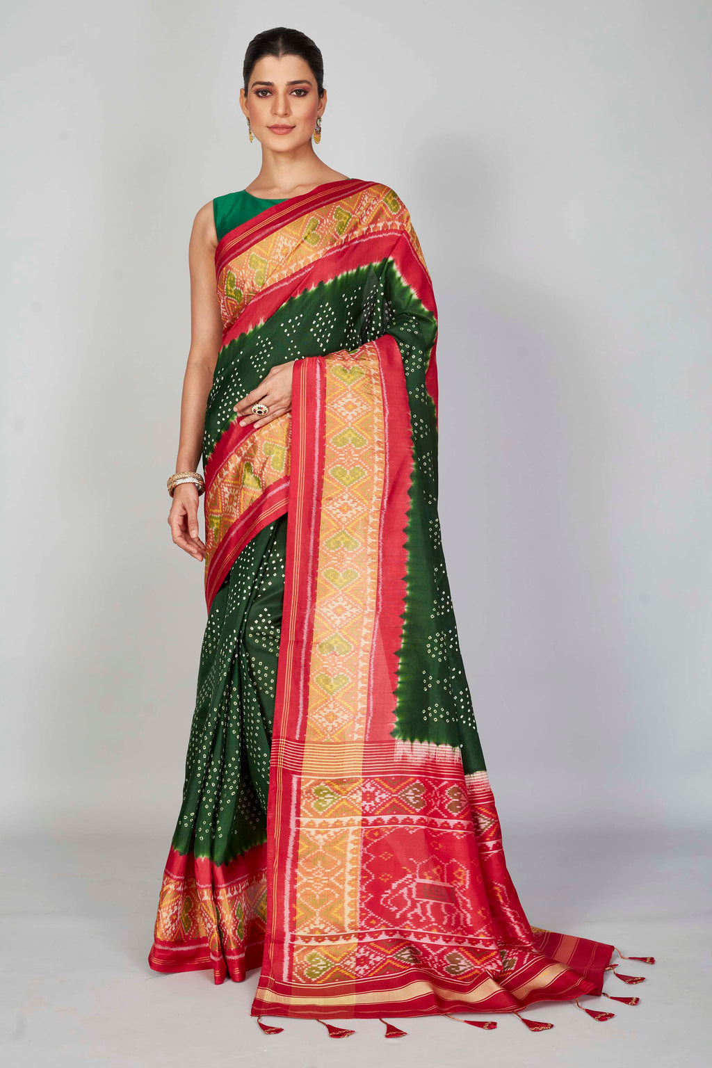 Shop bottle green silk Bandhej sari online in USA with red border. Look your best on festive occasions in latest designer saris, pure silk saris, Kanjivaram silk sarees, handwoven saris, tussar silk sarees, embroidered sarees from Pure Elegance Indian clothing store in USA.-full view