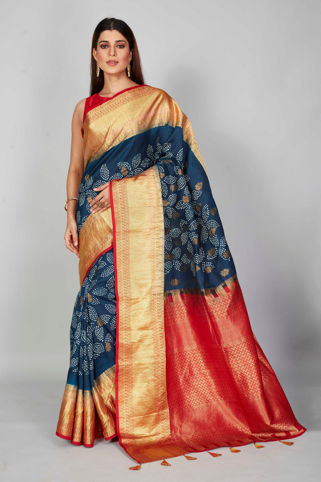 Buy dark blue silk Bandhej sari online in USA with red zari border. Look your best on festive occasions in latest designer saris, pure silk saris, Kanjivaram silk sarees, handwoven saris, tussar silk sarees, embroidered sarees from Pure Elegance Indian clothing store in USA.-full view