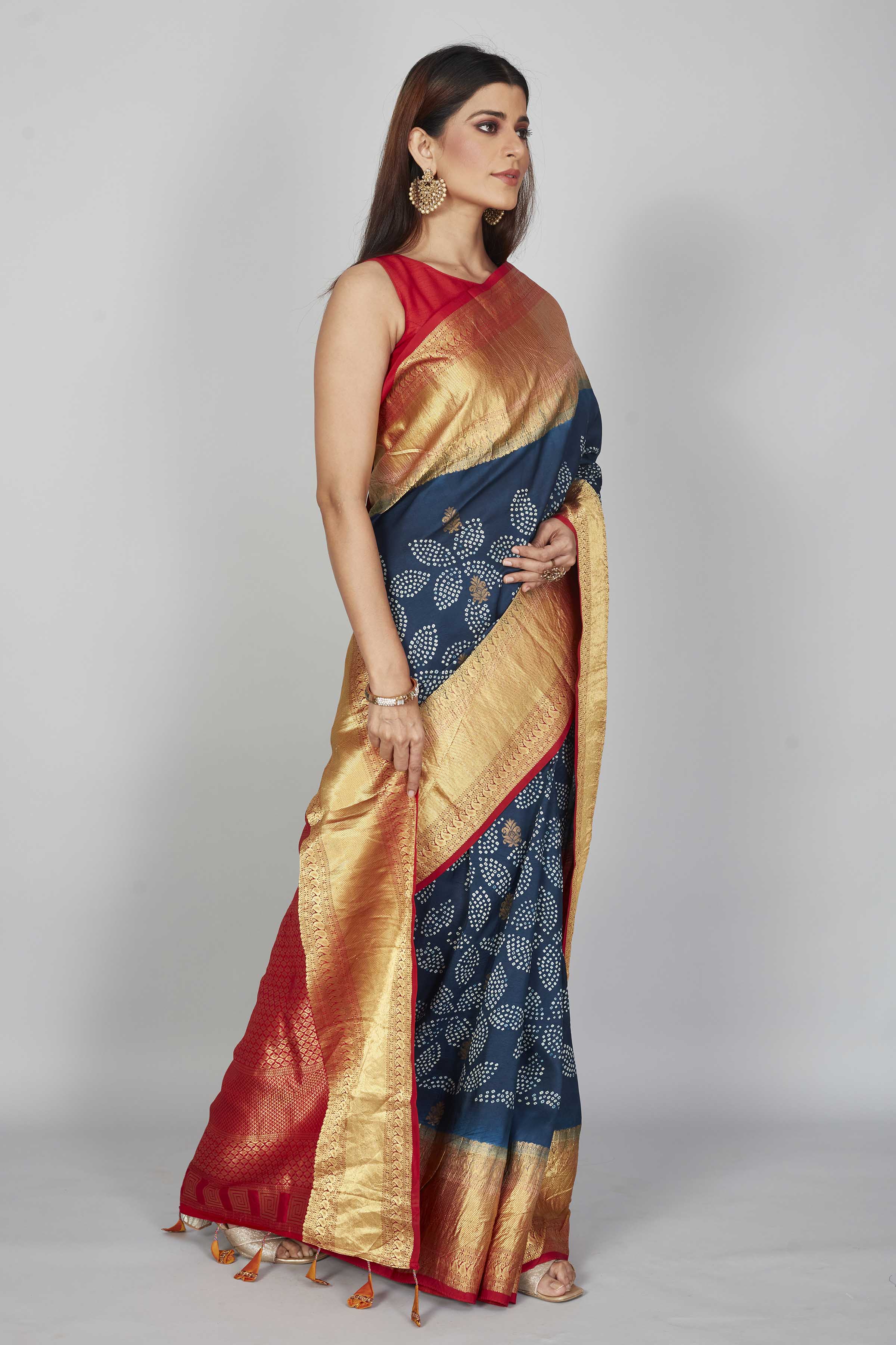 Buy dark blue silk Bandhej sari online in USA with red zari border. Look your best on festive occasions in latest designer saris, pure silk saris, Kanjivaram silk sarees, handwoven saris, tussar silk sarees, embroidered sarees from Pure Elegance Indian clothing store in USA.-side