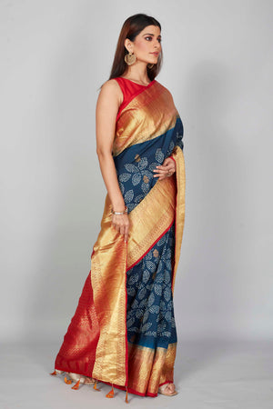 Buy dark blue silk Bandhej sari online in USA with red zari border. Look your best on festive occasions in latest designer saris, pure silk saris, Kanjivaram silk sarees, handwoven saris, tussar silk sarees, embroidered sarees from Pure Elegance Indian clothing store in USA.-side