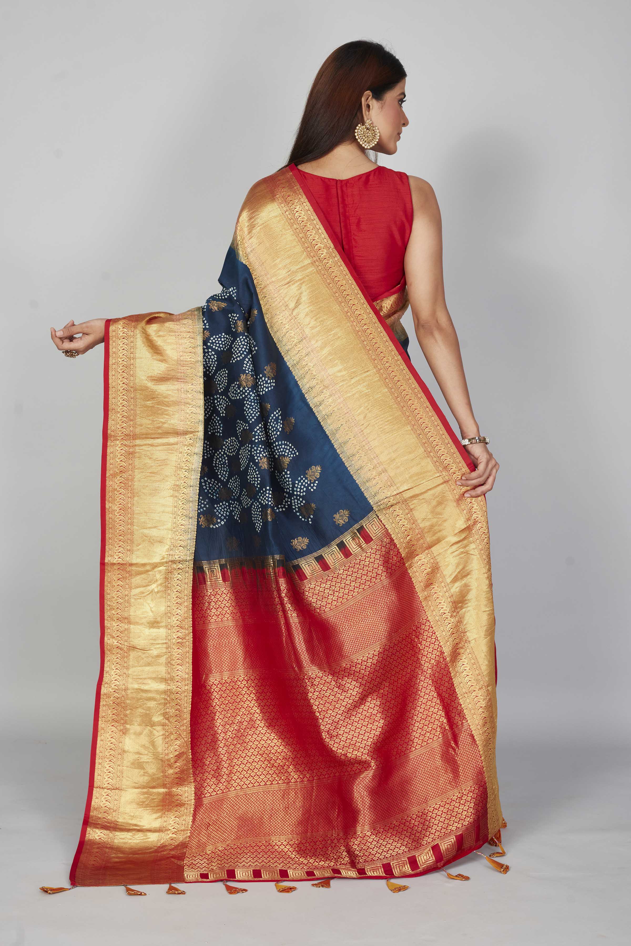 Buy dark blue silk Bandhej sari online in USA with red zari border. Look your best on festive occasions in latest designer saris, pure silk saris, Kanjivaram silk sarees, handwoven saris, tussar silk sarees, embroidered sarees from Pure Elegance Indian clothing store in USA.-back