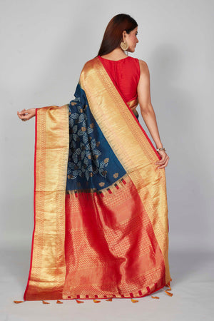 Buy dark blue silk Bandhej sari online in USA with red zari border. Look your best on festive occasions in latest designer saris, pure silk saris, Kanjivaram silk sarees, handwoven saris, tussar silk sarees, embroidered sarees from Pure Elegance Indian clothing store in USA.-back